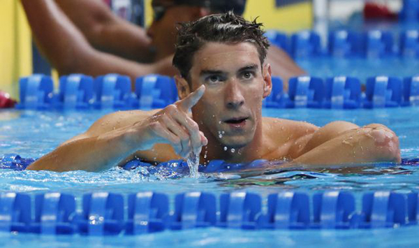 July 2, 2016; Omaha, NE, USA; Michael Phelps reacts after the men's 100m butterfly finals in the U.S. Olympic swimming team trials at CenturyLink Center. Mandatory Credit: Erich Schlegel-USA TODAY Sports